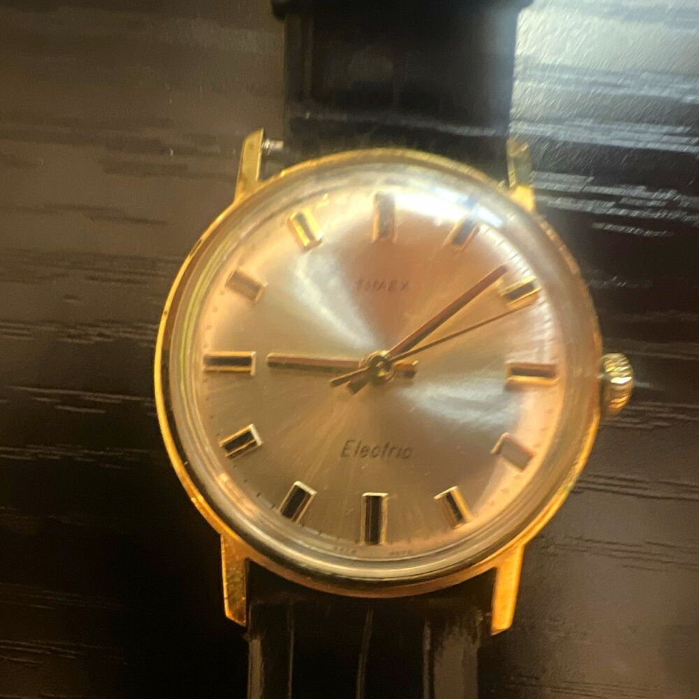 Timex Electric Men’s Analog Gold Tone Case Silver Sunburst Dial Black Leather